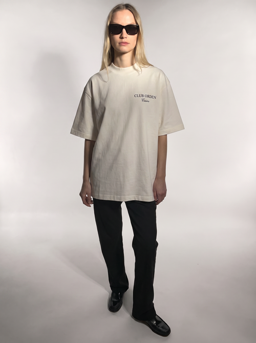 Club Orden Cairo Tee in Bone — oversized off-white heavyweight cotton tee with navy CLUB ORDEN Cairo chest print, front view