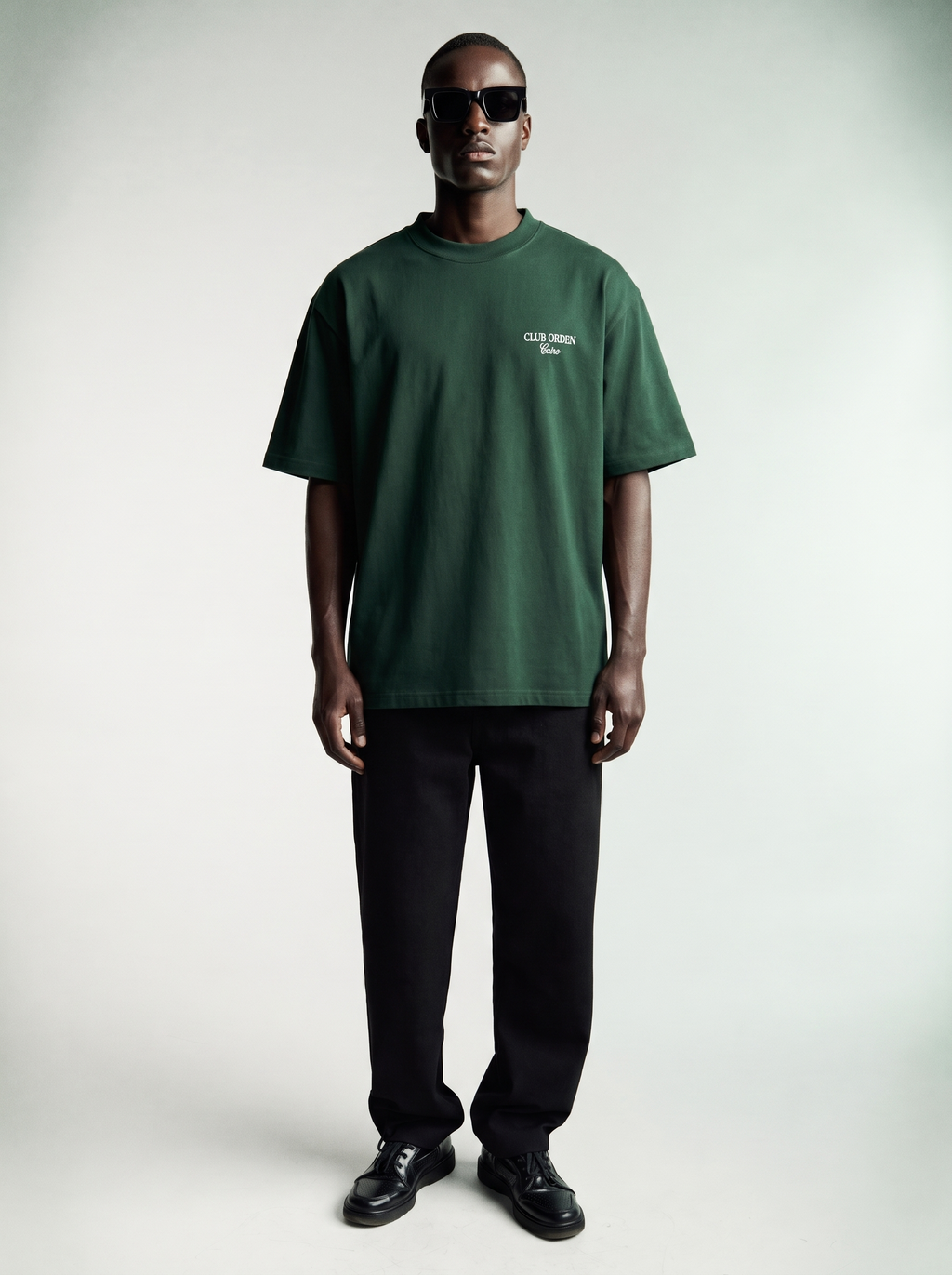 By Intention Tee in Green — oversized forest green heavyweight cotton tee with CLUB ORDEN Cairo chest print, front view
