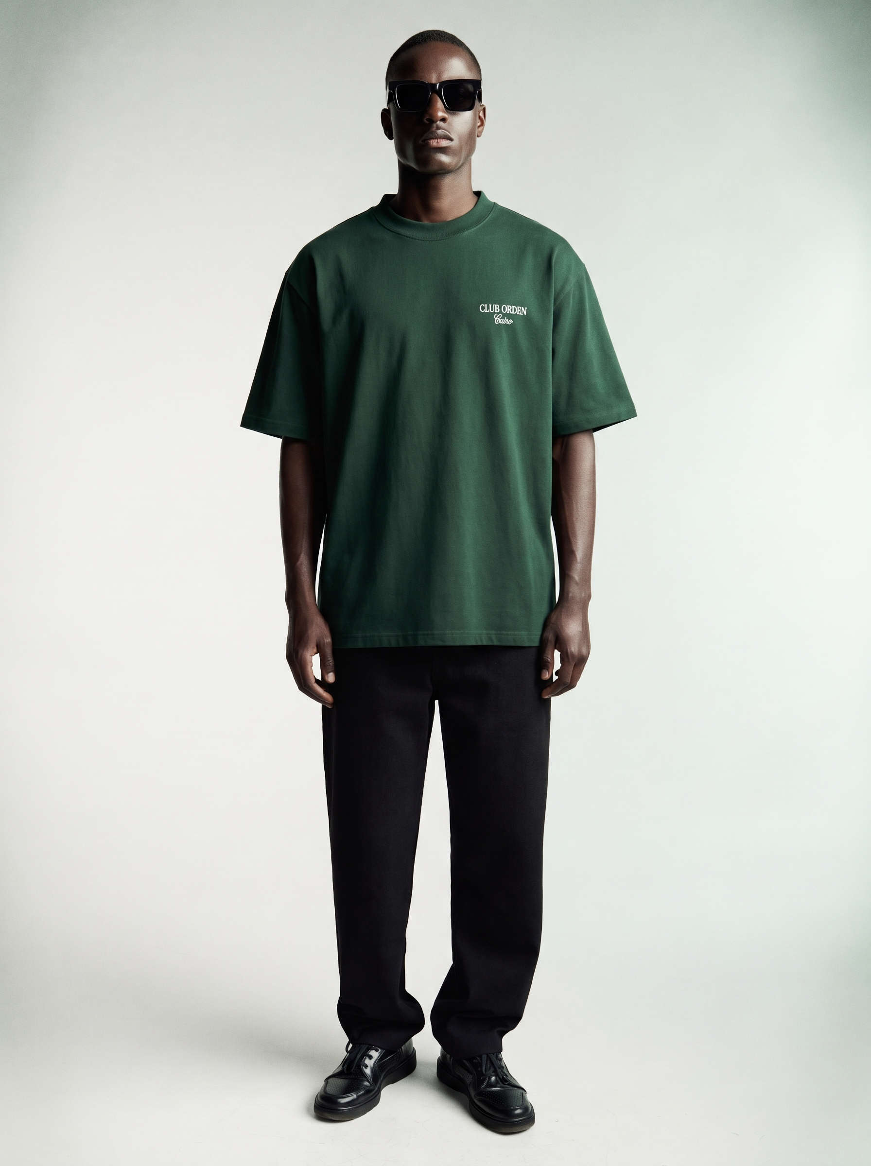 By Intention Tee in Green — oversized forest green heavyweight cotton tee with CLUB ORDEN Cairo chest print, front view