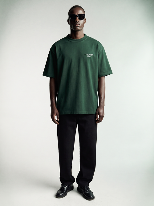 By Intention Tee in Green — oversized forest green heavyweight cotton tee with CLUB ORDEN Cairo chest print, front view